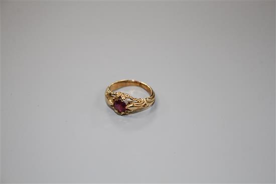 A late Victorian yellow metal and claw set solitaire garnet ring, size J, gross 4.2 grams.